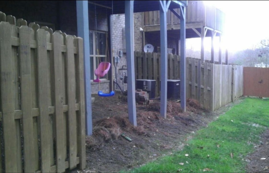 Fence & Timber Retaining Wall - Before