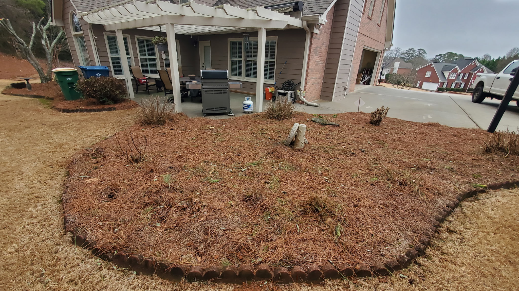 Raised Paver Patio & Stone Wall - Before