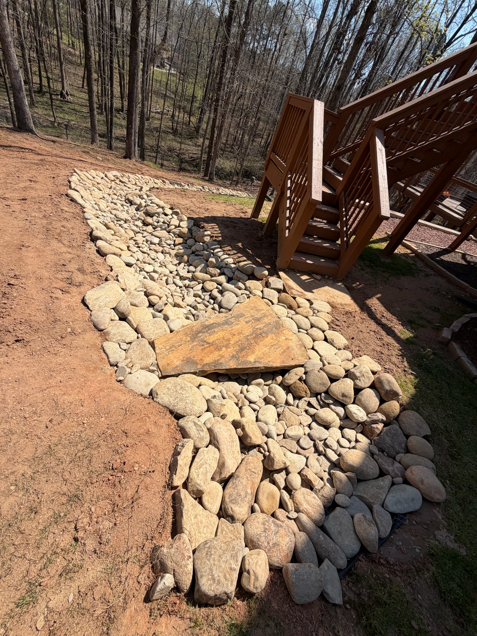 Dry creek bed with stone bridge