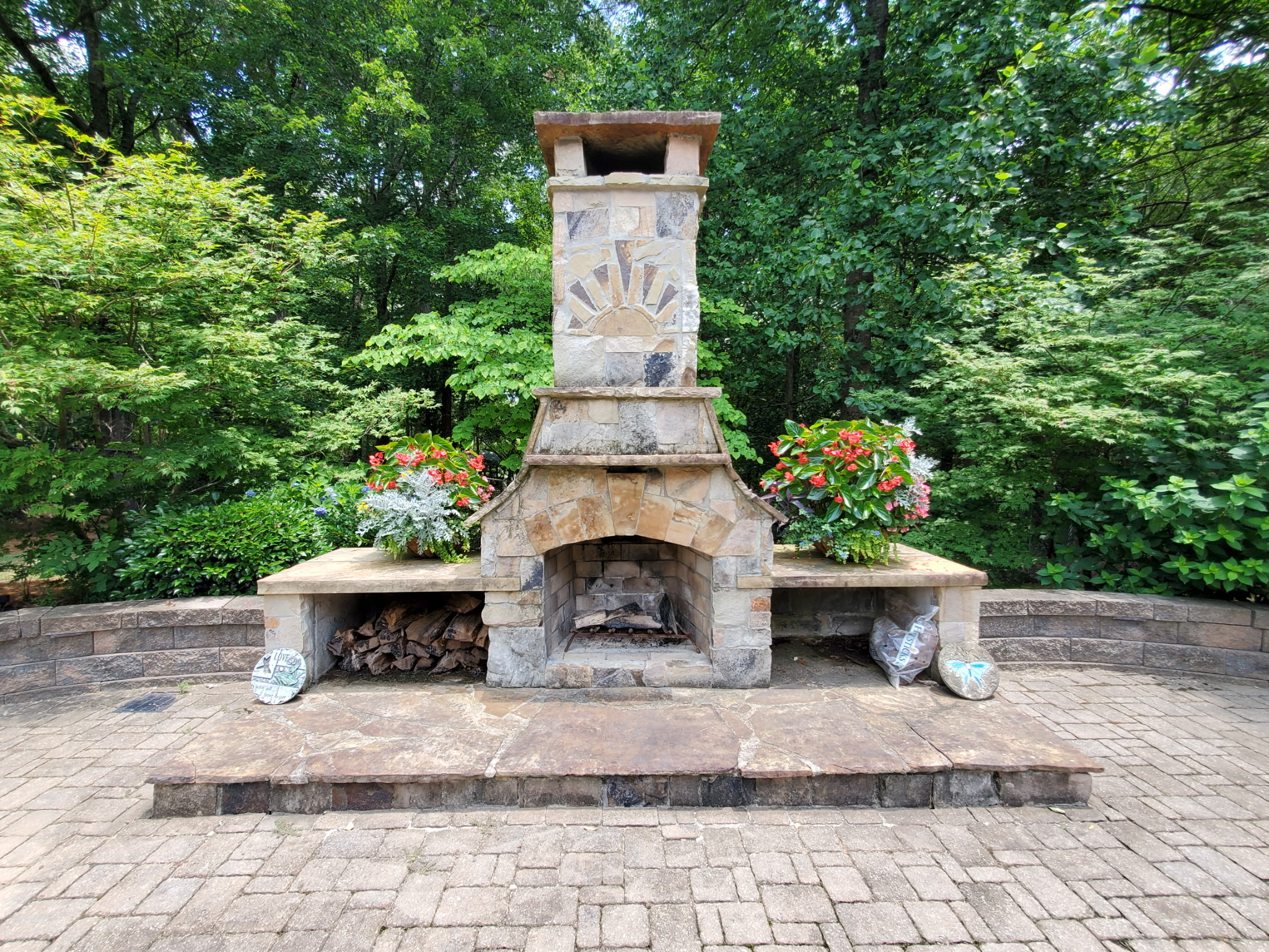 Outdoor fireplace with flower planters