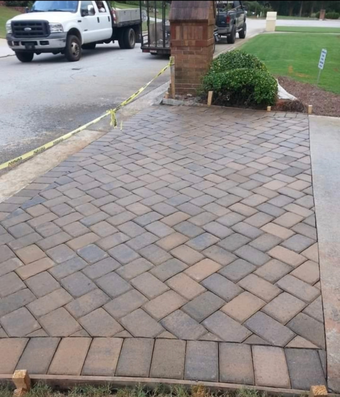 Herringbone paver driveway with soldier-course border